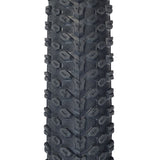 Close-up of the 14x2.125 (57-254) Pneumatic Tire for Electric Bikes, showcasing its knobby tread designed for optimal performance on both soft ground and hard concrete.