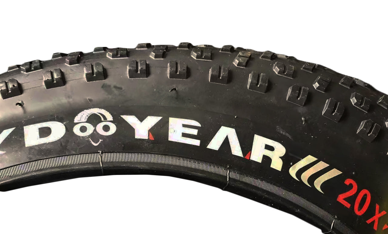 20x 4.0 Knobby Fat Bike Tire, showcasing close-up details of its aggressive tread pattern and sturdy knobs, ideal for off-road use and providing excellent cornering and braking traction.