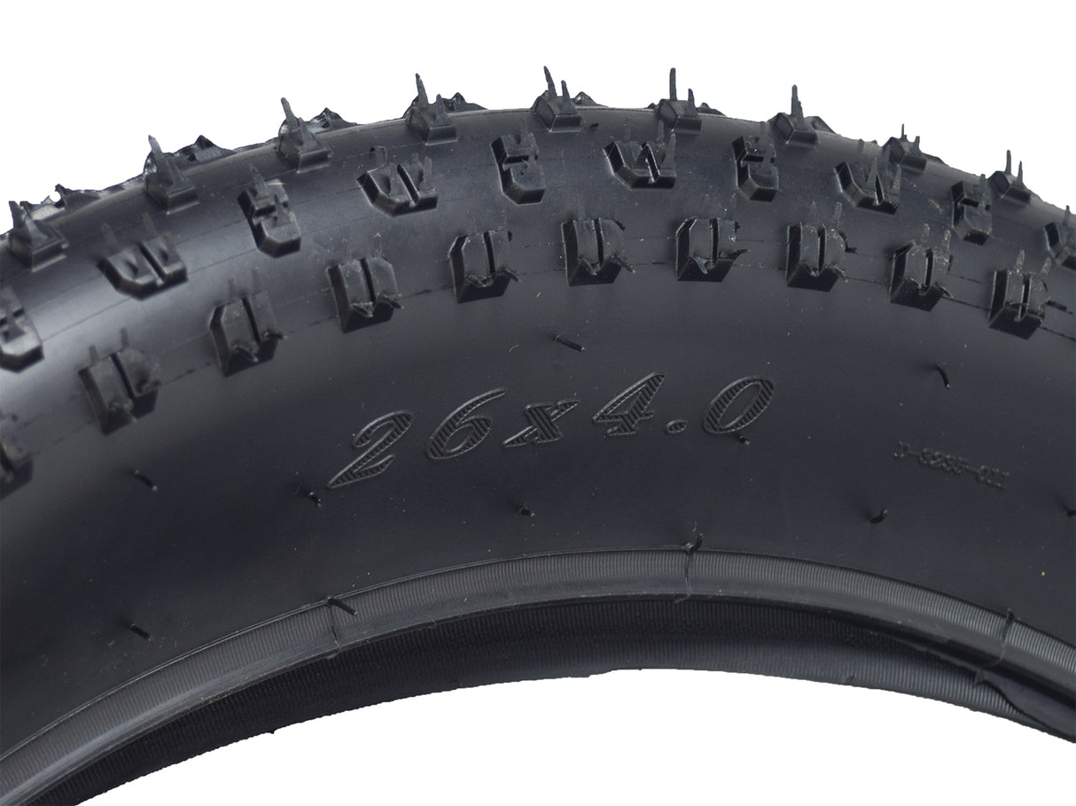 26x4 Knobby Fat Bike Tire with prominent spikes, designed for aggressive all-mountain and freeride biking, offering excellent cornering and braking traction on gravel and dirt trails.