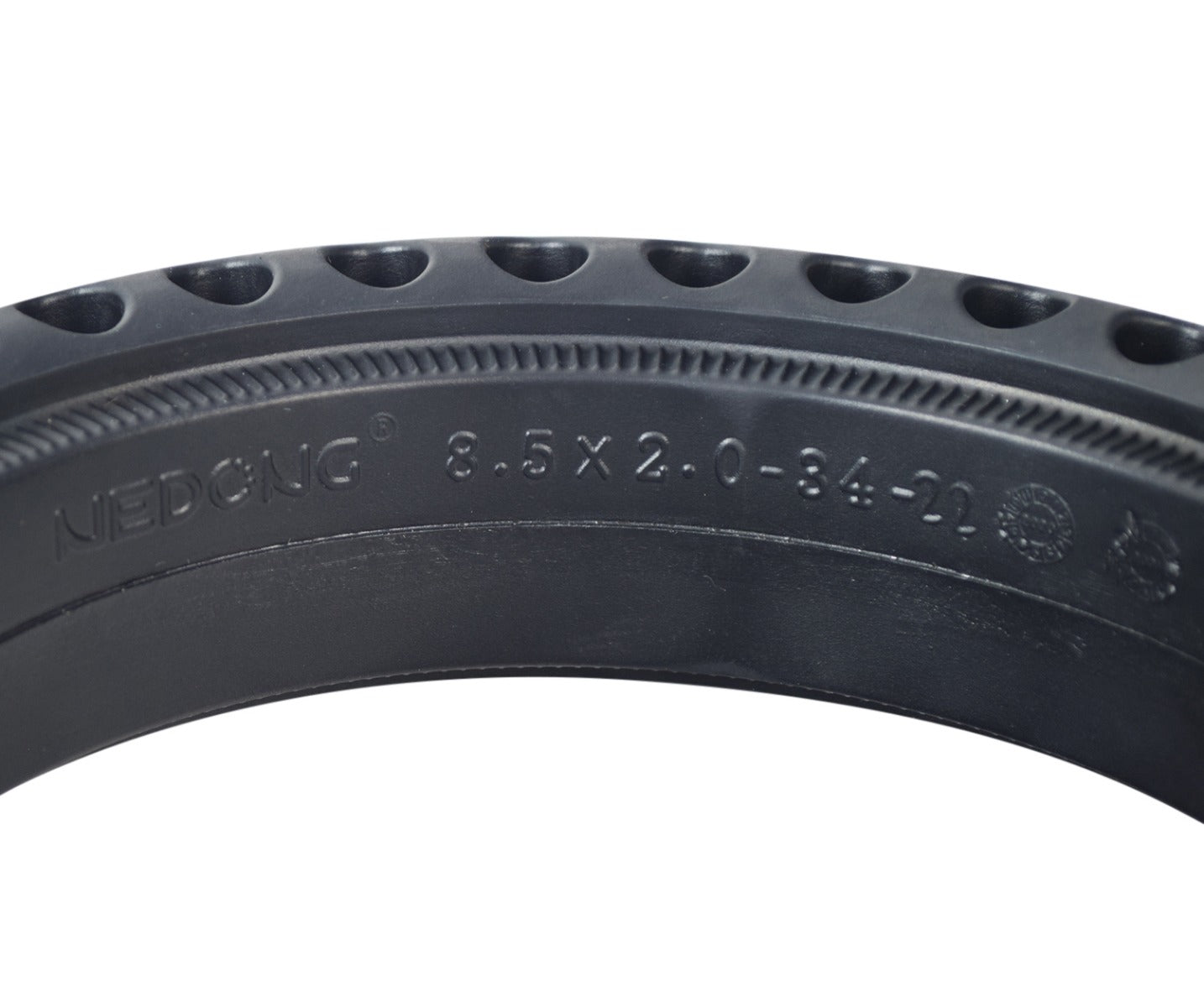 8.5 x 2 Solid Honeycomb Tire for Scooters, featuring open holes around the radius for shock absorption, made of black rubber with visible treads, ensuring flat-free performance.