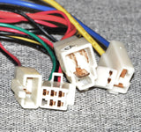 Close-up of colorful wires connected to the 201C6-3A / HB2430TYD-FS / HB2430-TYD-ROHS Control Module for Razor Dirt Quad (Versions 1-10).