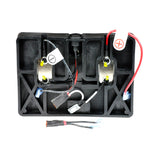 Battery Pack Harness Kit for the Rascal MicroBalance 170, featuring a black plastic device with wires and connectors, including a charger port and box lid, but excluding the batteries.