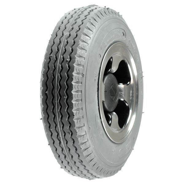 Close-up of the 9x3 (2.80/2.50-4) foam-filled rear wheel assembly for the Amigo MCX, RT Express (2003 and subsequent), and SmartShopper (2006-2007), featuring a detailed tire tread and silver rim.