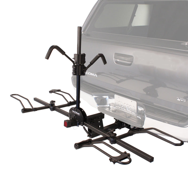 Recumbent Hitch Rack mounted on a car, showcasing its sturdy design for holding bikes or scooters securely.