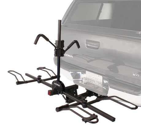 Recumbent Hitch Rack mounted on a car, showcasing its sturdy design for holding bikes or scooters securely.