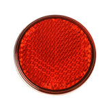 Red Rear Reflector for the Go-Go Elite Traveller, featuring a round, 45 mm diameter design with an adhesive back for easy attachment to scooters, enhancing visibility and safety.