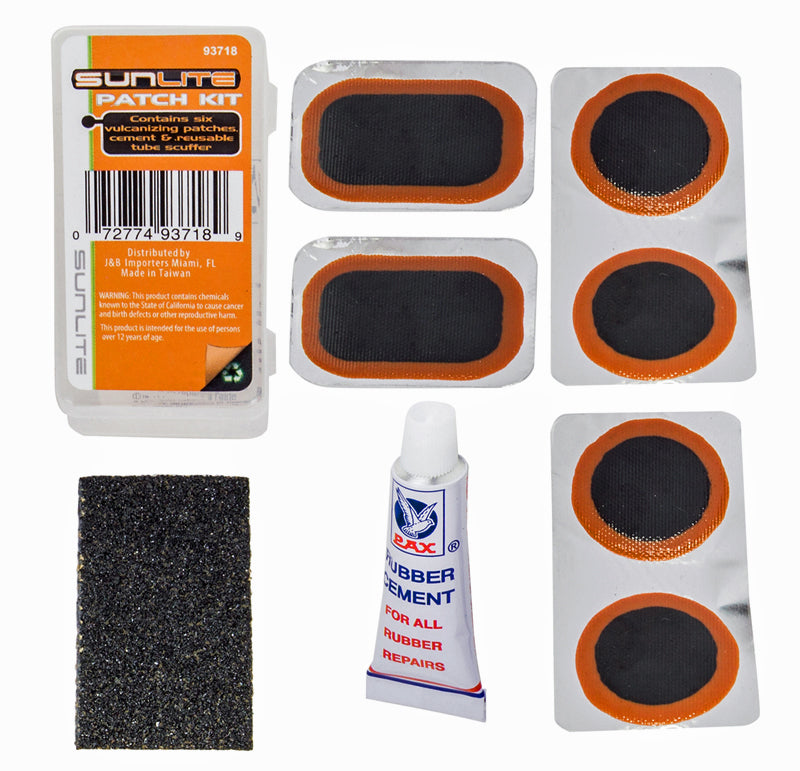 Road Patch Kit featuring a tube of rubber cement, a label tube scuff, and packs of black and orange circles for patching bike or scooter tires.