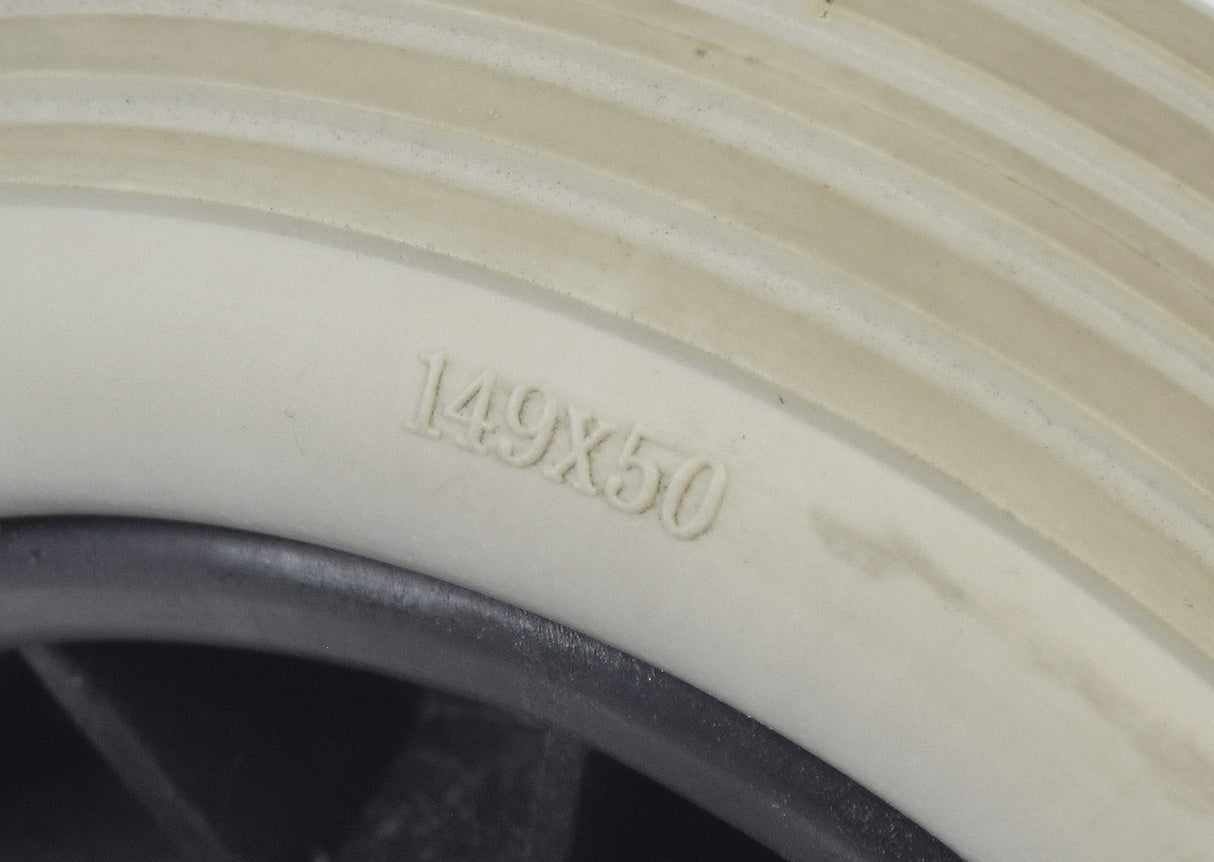 Front Wheel Assembly for Shoprider Power Chairs, featuring a close-up of a white tire with engraved numbers, suitable for various Shoprider mobility scooters.