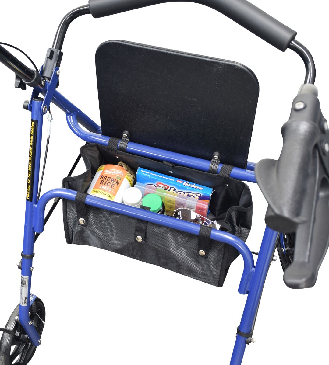 Under-Seat Tote Bag for Drive Medical Rollators 726, 728, & 10261 attached to a walker, filled with food items including brown rice and candy, showcasing its sturdy black fabric and snap-on straps.