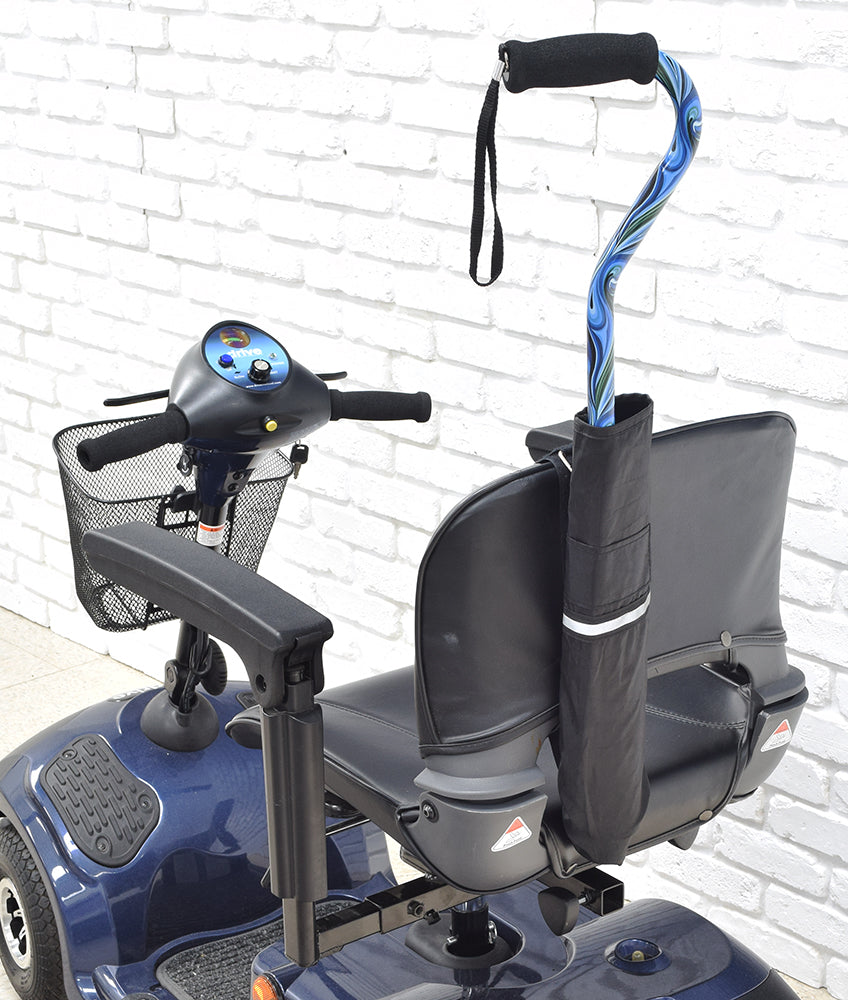 Cane Holder for Golden Scooters & Power Chairs shown attached to the backrest of a scooter, featuring a secure adjustable nylon strap and a ripstop fabric pouch for carrying canes.