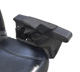 Saddle Bag for Mobility Scooters, Power Chairs, & Wheelchairs featuring a secure Velcro-fastened top pouch, additional zippered pouches, and reflective safety tape, mounted on a black armrest for easy access.