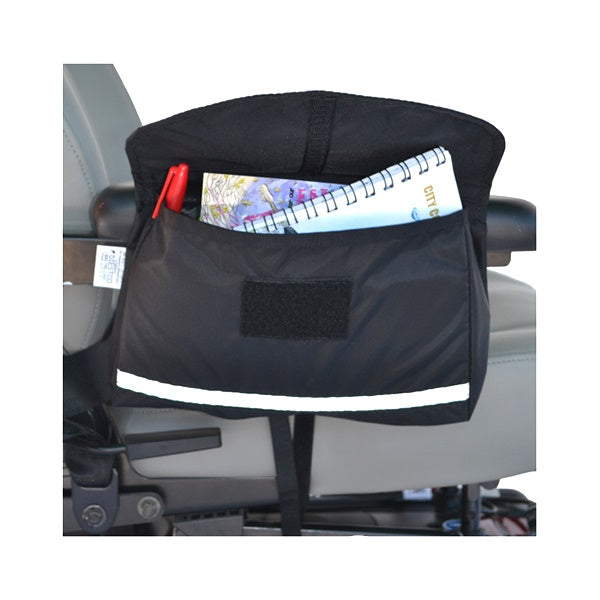 Saddle Bag for Mobility Scooters, Power Chairs, & Wheelchairs showing a black bag with a spiral notebook and pen inside. The bag features a Velcro top pouch and zippered extra pouches.