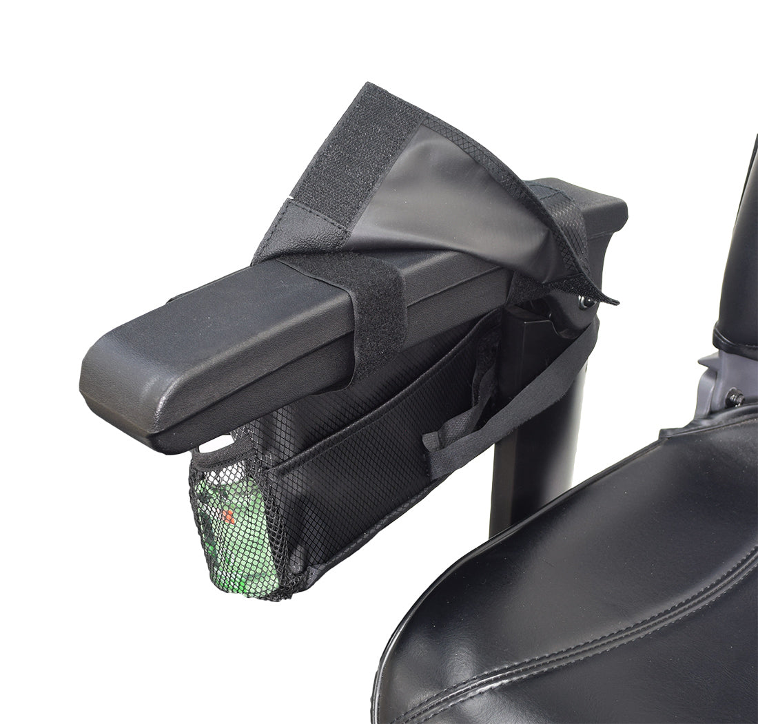 Saddle Bag for Mobility Scooters, Power Chairs, & Wheelchairs: A durable black nylon bag with multiple pockets, zippers, and a Velcro fastener, attached to a black armrest.