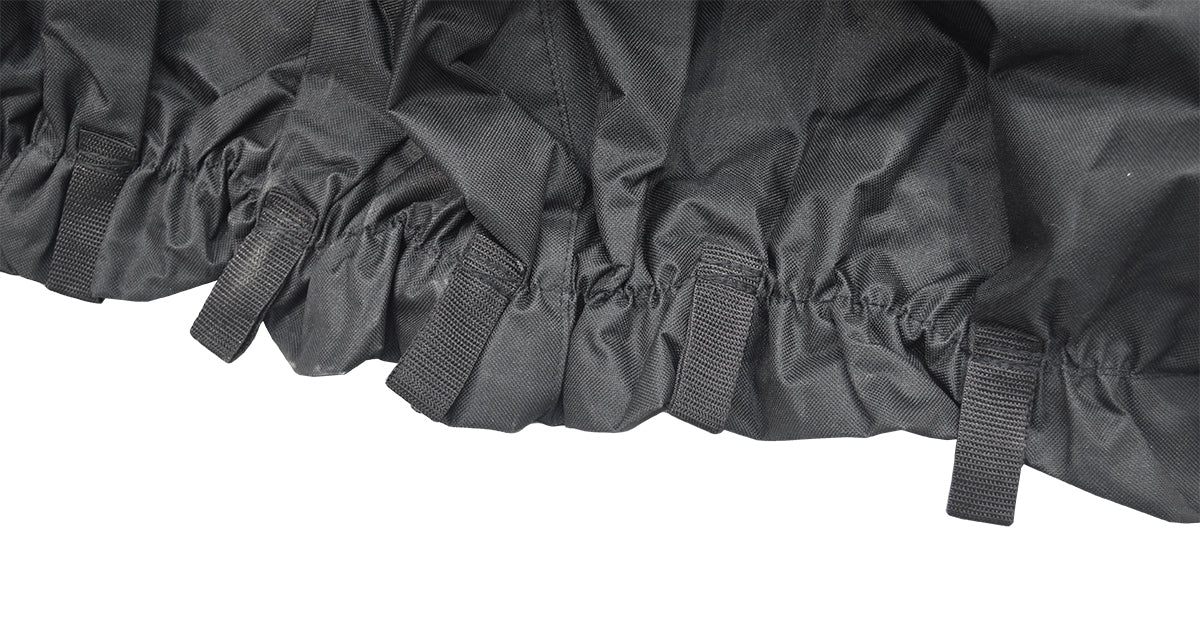 Close-up of the Heavy Duty Weatherproof Cover for Power Chairs, showing durable black fabric with ruffled edge, draw cord, and grommets for secure fit.