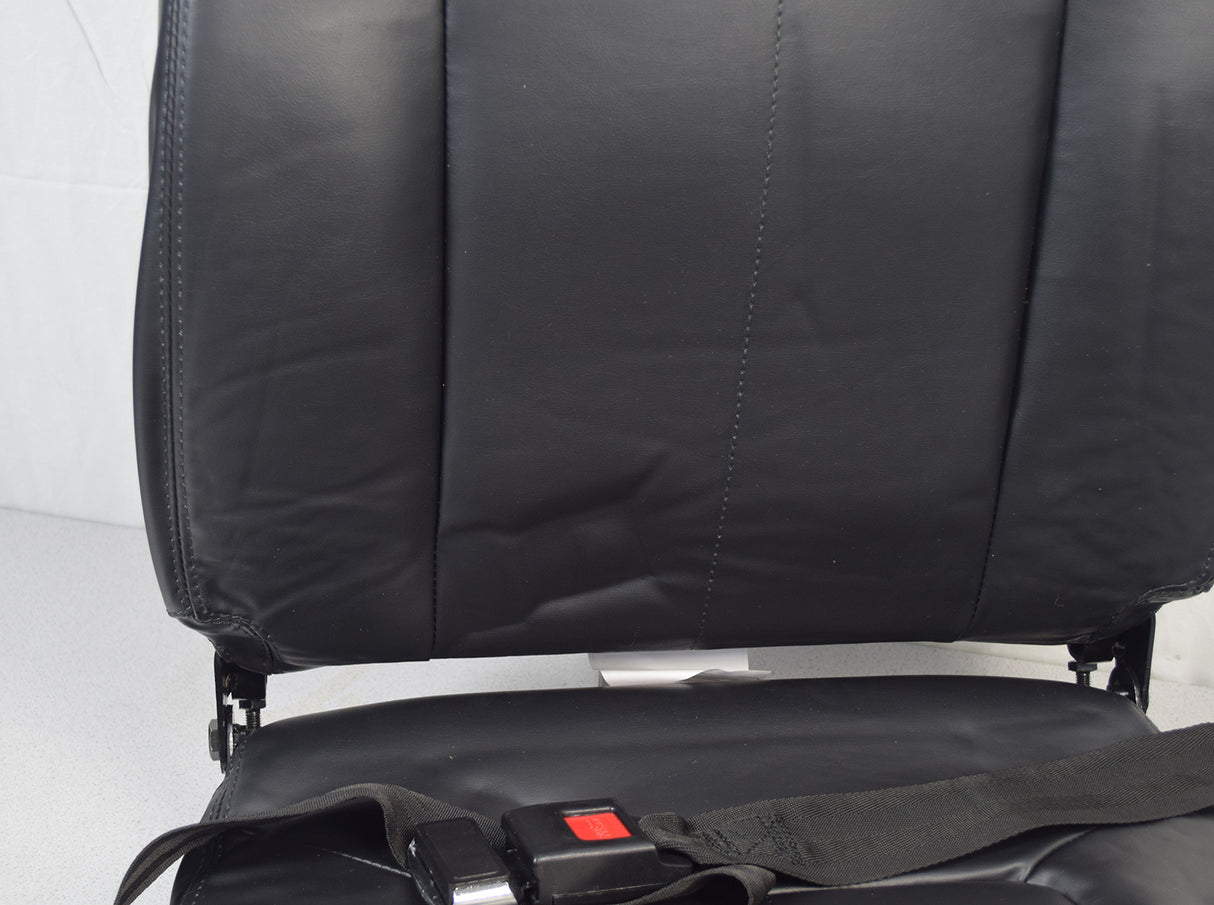 Seat Assembly for the Shoprider Streamer Sport (888WAB)(Blemished) showing a black vinyl seat with a seat belt and red button, excluding armrests and adjustment knobs.