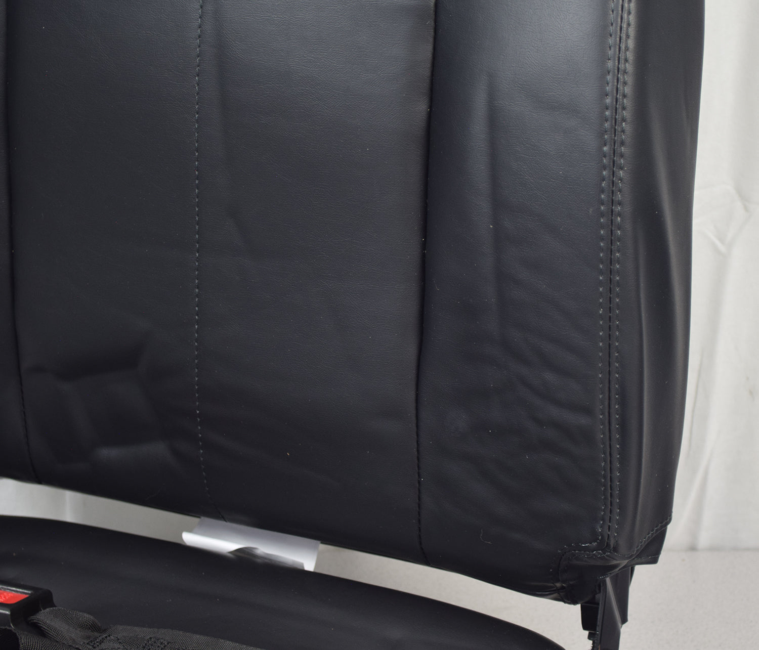 Seat Assembly for the Shoprider Streamer Sport (888WAB)(Blemished) featuring a black vinyl upholstered chair with a seat post and seat belt, excluding armrests and adjustment knobs.