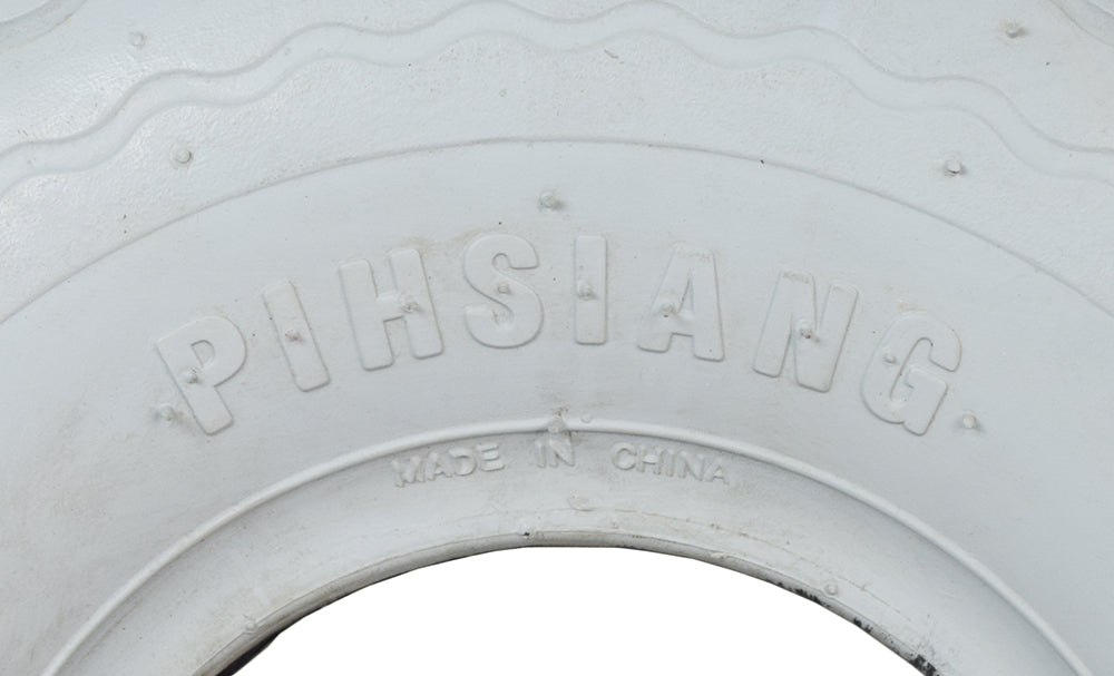 Close-up of the 4.00-5 (13x4, 330x100) Pneumatic Front Tire for Shoprider Sprinter XL3 & XL4 Deluxe Scooters, featuring a zigzag tread pattern for optimal traction and smooth rollability.