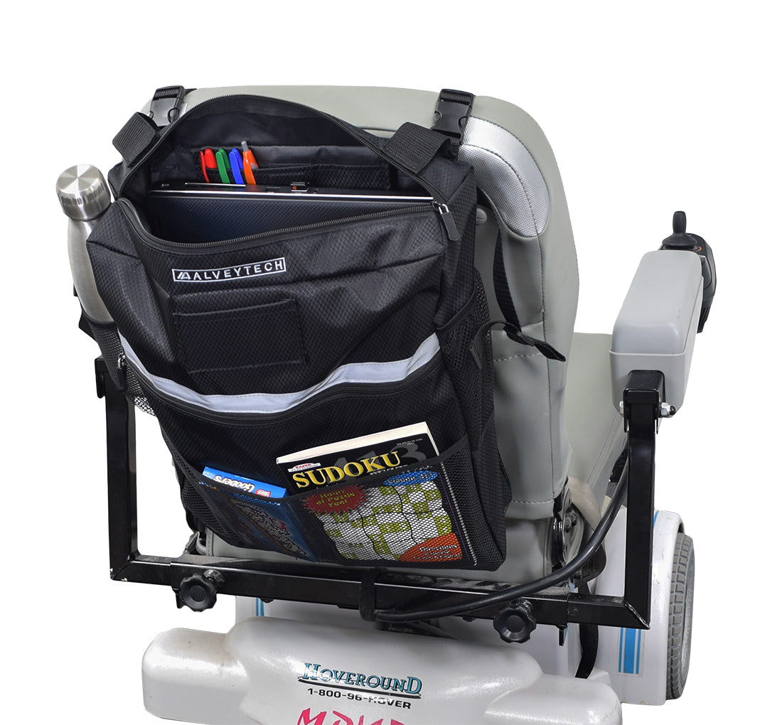 Seat Back Bag (Backpack) for Mobility Scooters & Power Chairs shown on a chair, featuring multiple compartments including a zippered main compartment, outer zippered pocket, and an open mesh pouch.