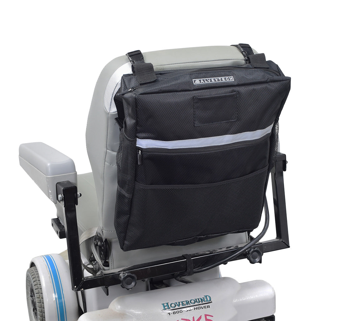 Seat Back Bag (Backpack) for Mobility Scooters & Power Chairs, shown attached to a wheelchair, with multiple compartments including a zippered main section, outer pouch, and mesh pocket for versatile storage.