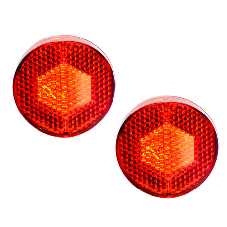 Rear Fender Reflector for Schwinn Meridian Trikes (Set of 2) - Close-up of two round red reflectors designed to mount on the rear fenders. Suitable for other bike and scooter applications.