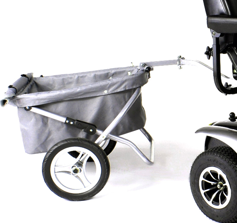 Trailer for Mobility Scooters: Close-up of a grey aluminum and fabric cart with wheels, featuring a removable soft cover and folding design for easy storage. Ideal for transporting bulky items behind electric scooters.