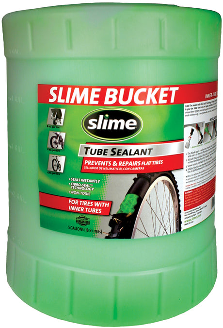 Slime Tube Sealant - 5 Gallon Bucket: Green plastic container labeled Slime, designed for repairing bicycle tire punctures up to 3mm, installs through valve stem by removing the valve core.