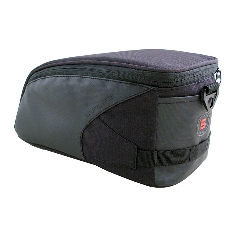 Small RackPack Bag made from water-resistant 600D polyester, featuring reflective trim, heavy-duty zippers, and a leather strap. It has two compartments and mounts easily on a bike rack with velcro straps.