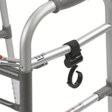 Swivel hook strapped to the crossbar of a folding walker, ready to hang a bag or pouch