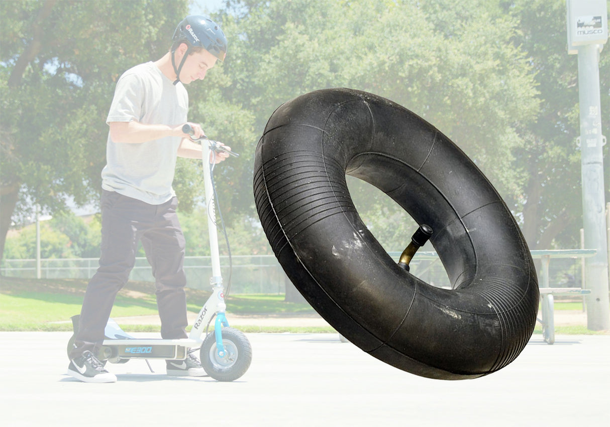 Man riding a scooter with a floating tire, showcasing the 3.00-4 (10x3, 260x85) Scooter and Power Chair Inner Tube with angled valve stem, ideal for mobility scooters and power chairs.