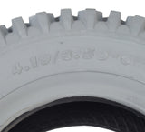 Close-up of the 4.10/3.50-6 Pneumatic Mobility Tire with C156G Nimble Knobby Tread, showing detailed treads and part of the tire's sidewall design, emphasizing its durability for scooters and power chairs.