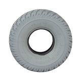 3.00-4 (10x3) Mobility Tire and Inner Tube Set with Durotrap Tread, showing a close-up of the non-marking gray rubber tire with in-cut tread and the included inner tube with angled valve stem.