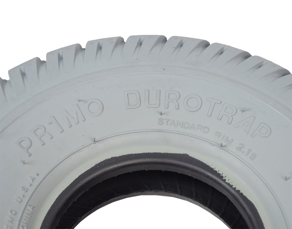 Close-up of the 10x3 (3.00-4, 260x85) Gray Pneumatic Mobility Tire with C9210 Durotrap Tread, showing its detailed in-cut tread pattern for smooth rolling.