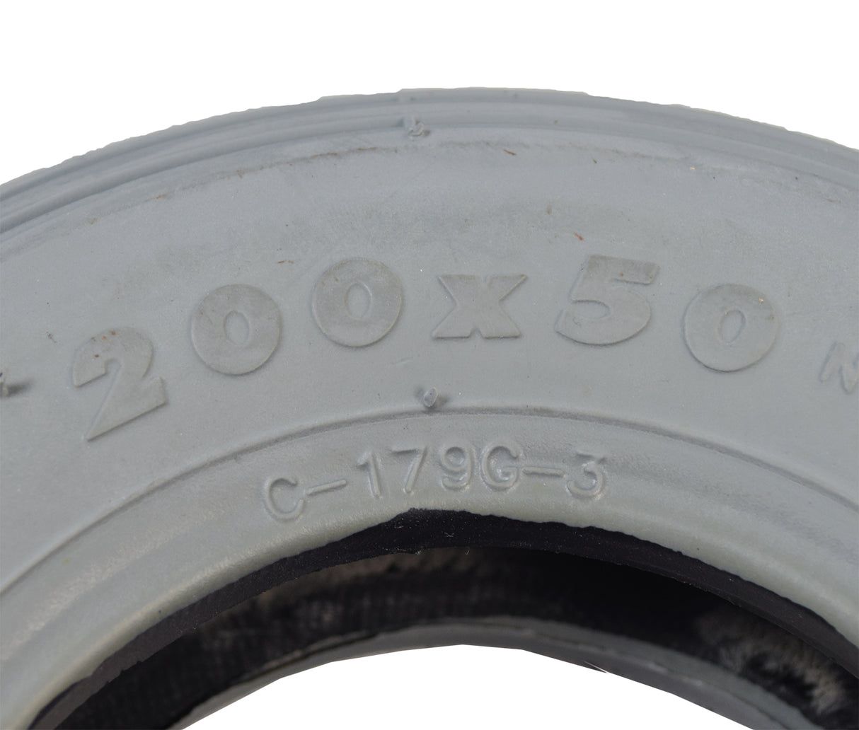 Close-up of the 8x2 (200x50) Pneumatic Mobility Tire with C179G Spirit Ribbed Tread, showing detailed grooves and non-marking gray rubber, ideal for mobility scooters and power chairs.