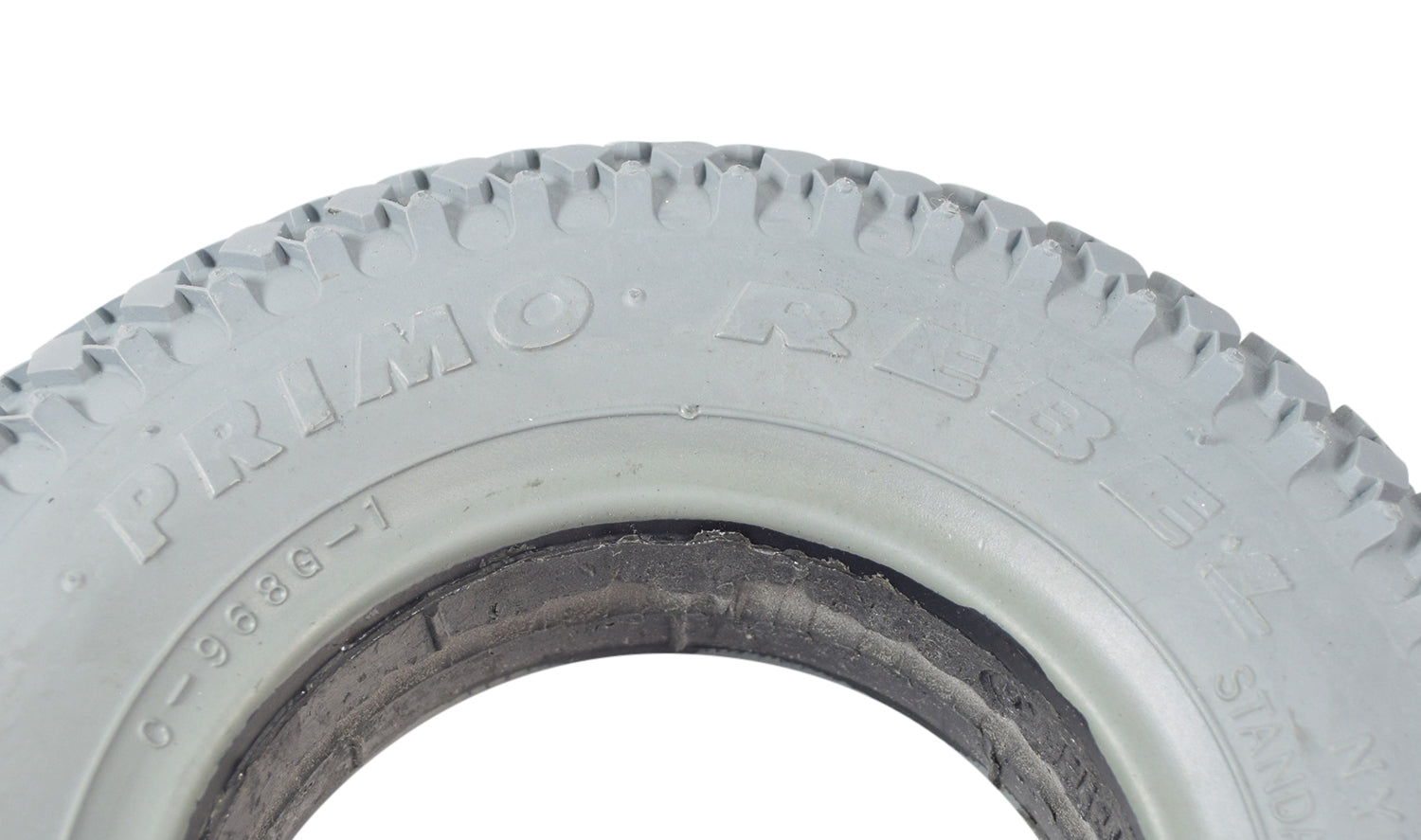 Close-up of an 8x2 (200x50) Foam-Filled Mobility Tire with C968G Rebel Knobby Tread, highlighting the durable tread pattern designed to prevent flats and ensure a smooth ride.