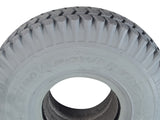 Close-up of a 3.00-4 (10x3, 260x85) Foam-Filled Gray Tire for the ActiveCare Pilot (2310/2410) Scooters & ActiveCare Power Chairs, featuring non-marking gray rubber and detailed tread patterns.