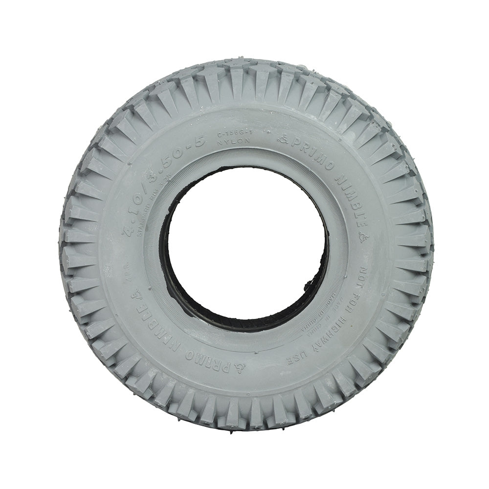 4.10x3.50-5 Pneumatic Mobility Tire with Nimble Knobby Tread, close-up of a white tire with a central hole, showcasing the detailed knobby tread pattern for smooth indoor and outdoor use.