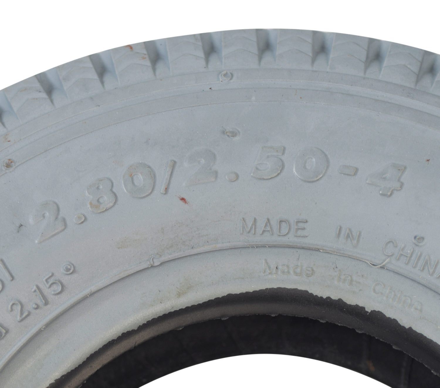 Close-up of the 2.80/2.50-4 (9x3) Pneumatic Mobility Tire with C178G Power Edge Sawtooth Tread, showcasing detailed tread patterns and a robust, non-marking rubber surface.