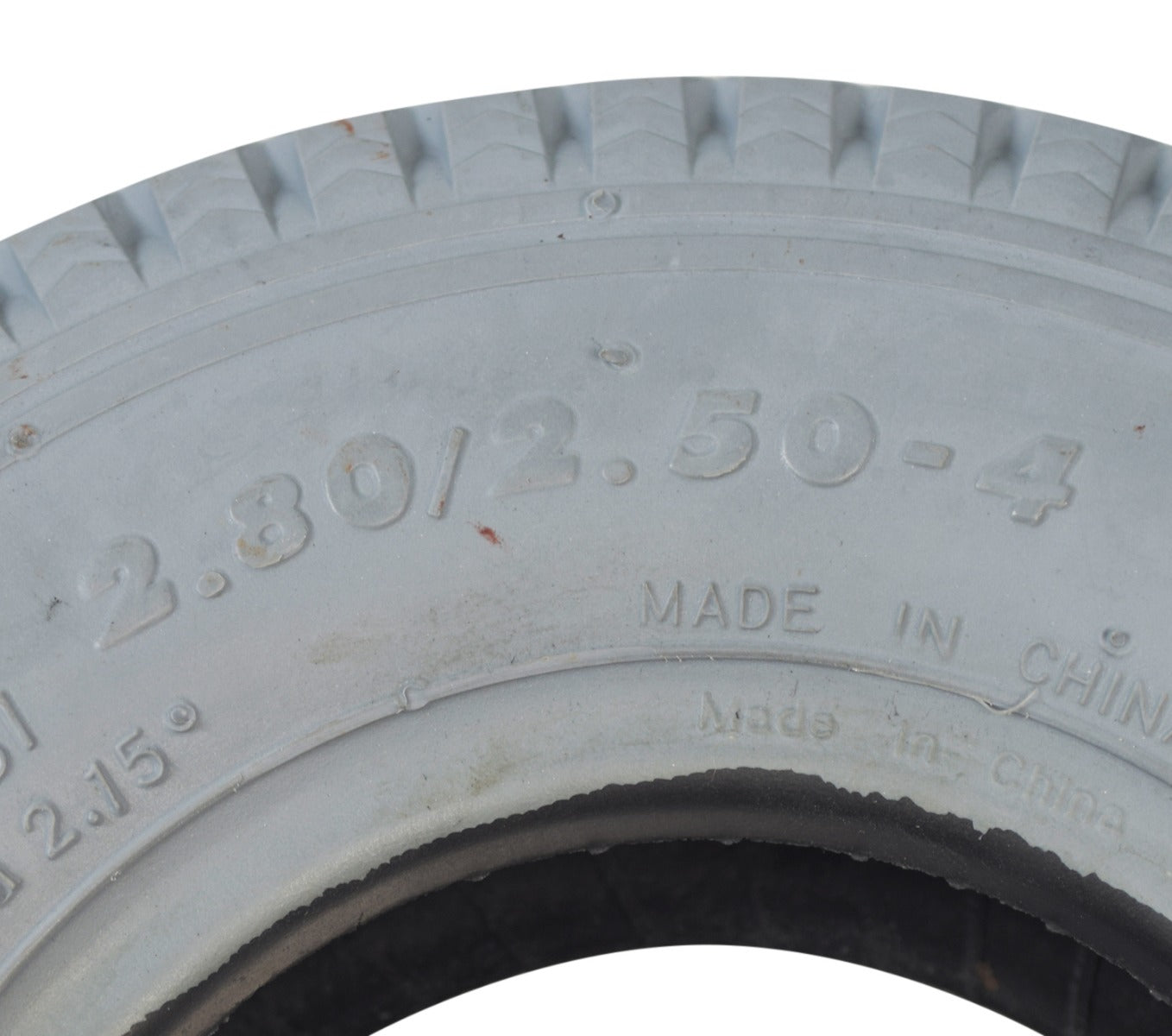 Close-up of the 2.80/2.50-4 (9x3) Mobility Tire and Inner Tube Set with Power Edge Sawtooth Tread, highlighting the intricate tire tread pattern designed for mobility scooters and utility carts.