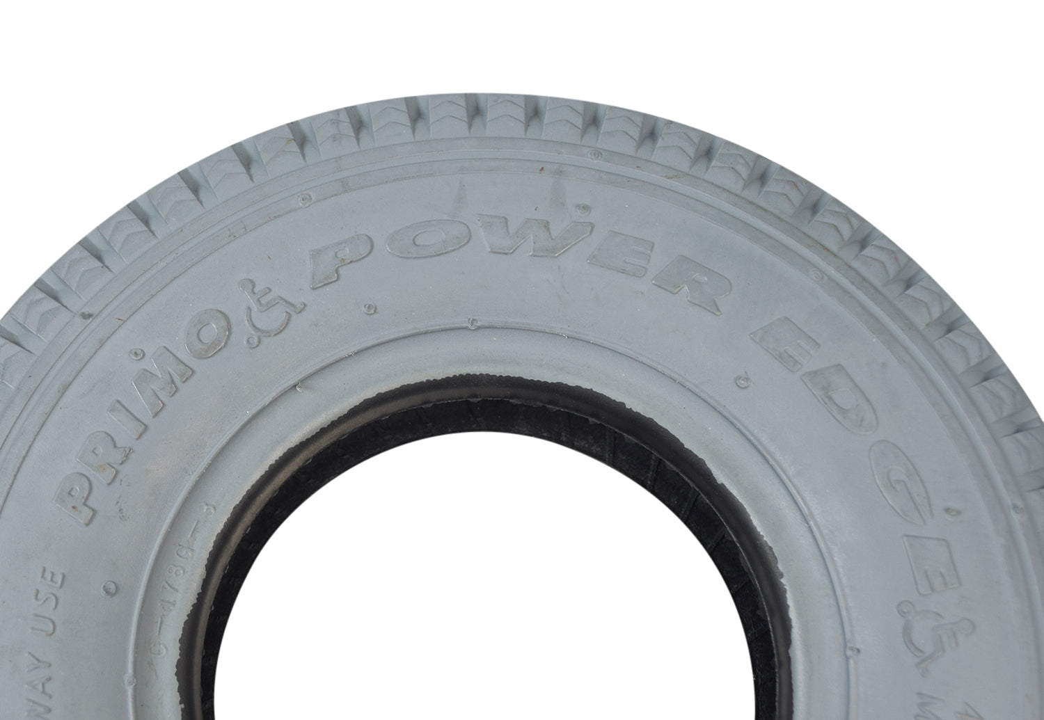 Close-up of the 2.80/2.50-4 (9x3) Pneumatic Mobility Tire with C178G Power Edge sawtooth tread, showcasing the detailed texture and rubber material, emphasizing its suitability for smooth indoor or outdoor use.