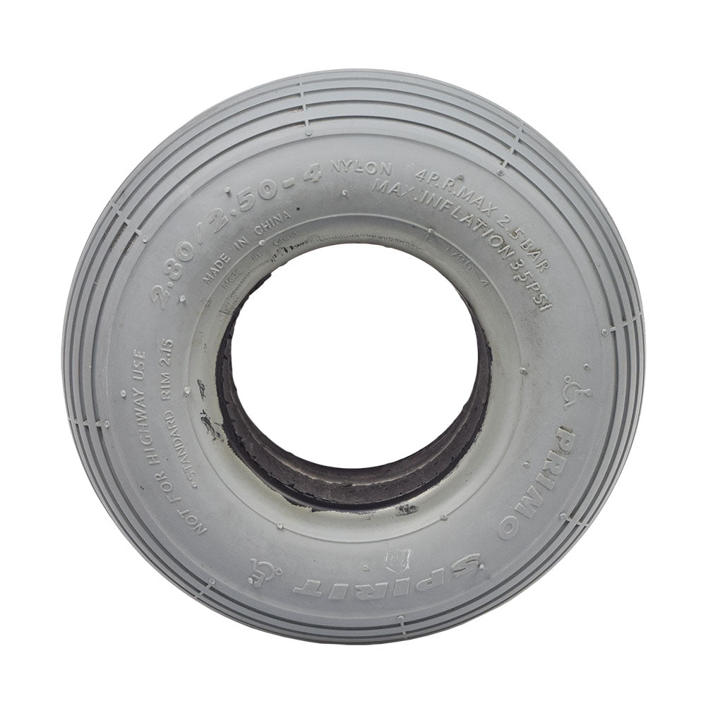 2.80/2.50-4 (9x3) Foam-Filled Mobility Tire with C179G Spirit Ribbed Tread, featuring a close-up of its white circular structure and central hole, highlighting the ribbed tread design.