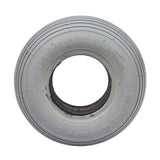 2.80/2.50-4 (9x3) Foam-Filled Mobility Tire with C179G Spirit Ribbed Tread, featuring a close-up of its white circular structure and central hole, highlighting the ribbed tread design.