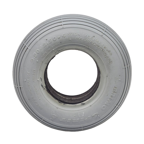 2.80/2.50-4 (9x3) Foam-Filled Mobility Tire with C179G Spirit Ribbed Tread, featuring a close-up of its white circular structure and central hole, highlighting the ribbed tread design.