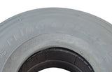 Close-up of the 3.00-4 (10x3, 260X85) Foam-Filled Mobility Tire with C170G Spirit Ribbed Tread, showcasing its detailed tread pattern and solid, non-marking gray rubber construction.