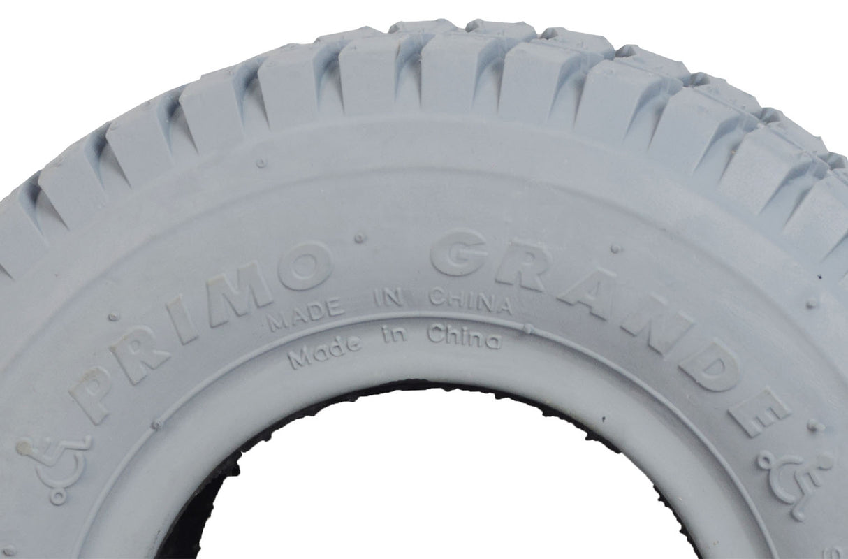 Close-up of the 9x3.50-4 Pneumatic Mobility Tire with C203 Grande Knobby Tread, showcasing its detailed tread pattern and robust construction, ideal for power wheelchairs and scooters.