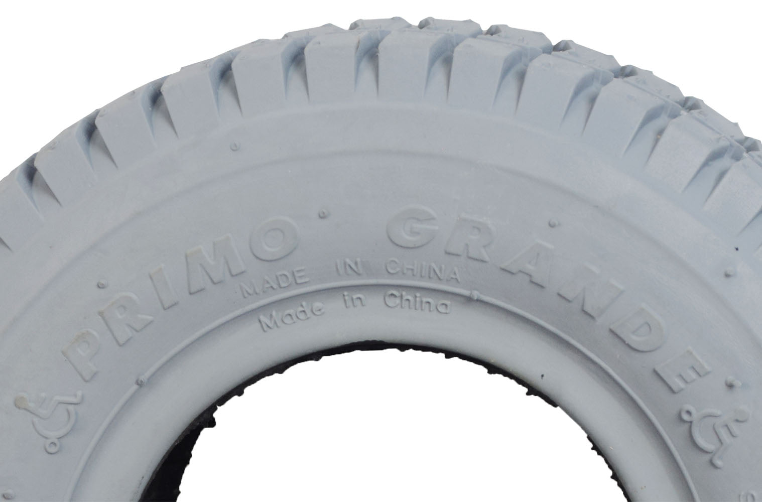 Close-up of a 9x3.50-4 Mobility Tire and Inner Tube Set with Grande Tread, featuring a knobby tread pattern, designed for mobility scooters and power chairs like the Hoveround MPV 4 and MPV 5.