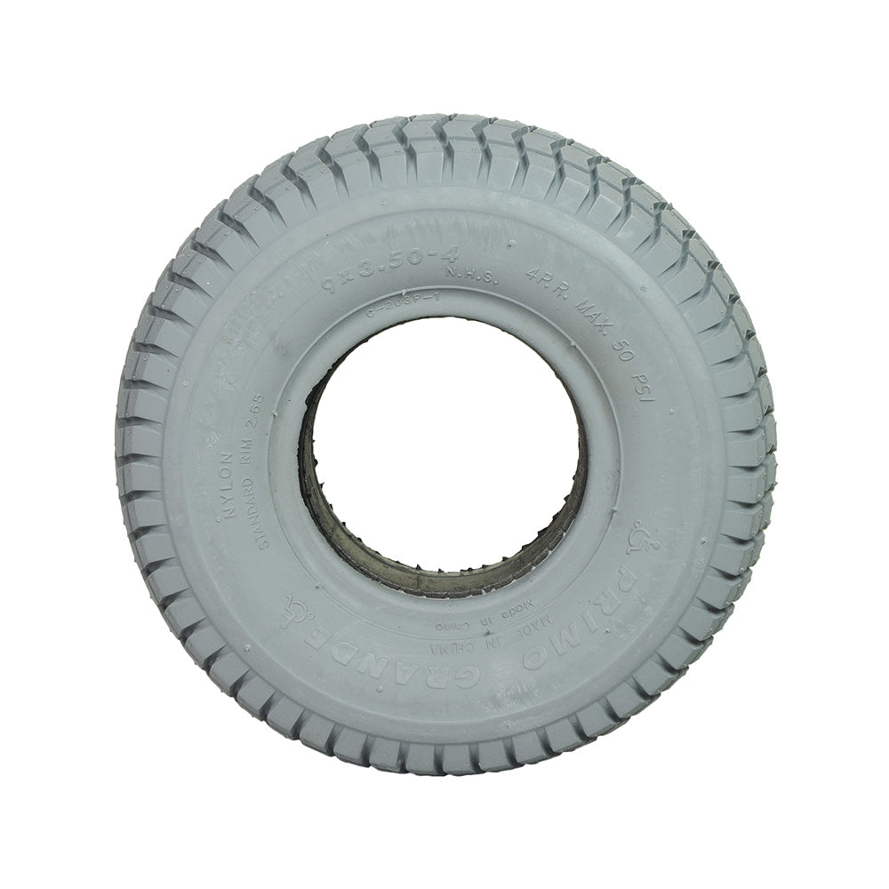 9x3.50-4 Foam Filled Mobility Tire with C203 Grande Knobby Tread, shown as a close-up of a white tire with a central hole, suitable for mobility scooters and power chairs.