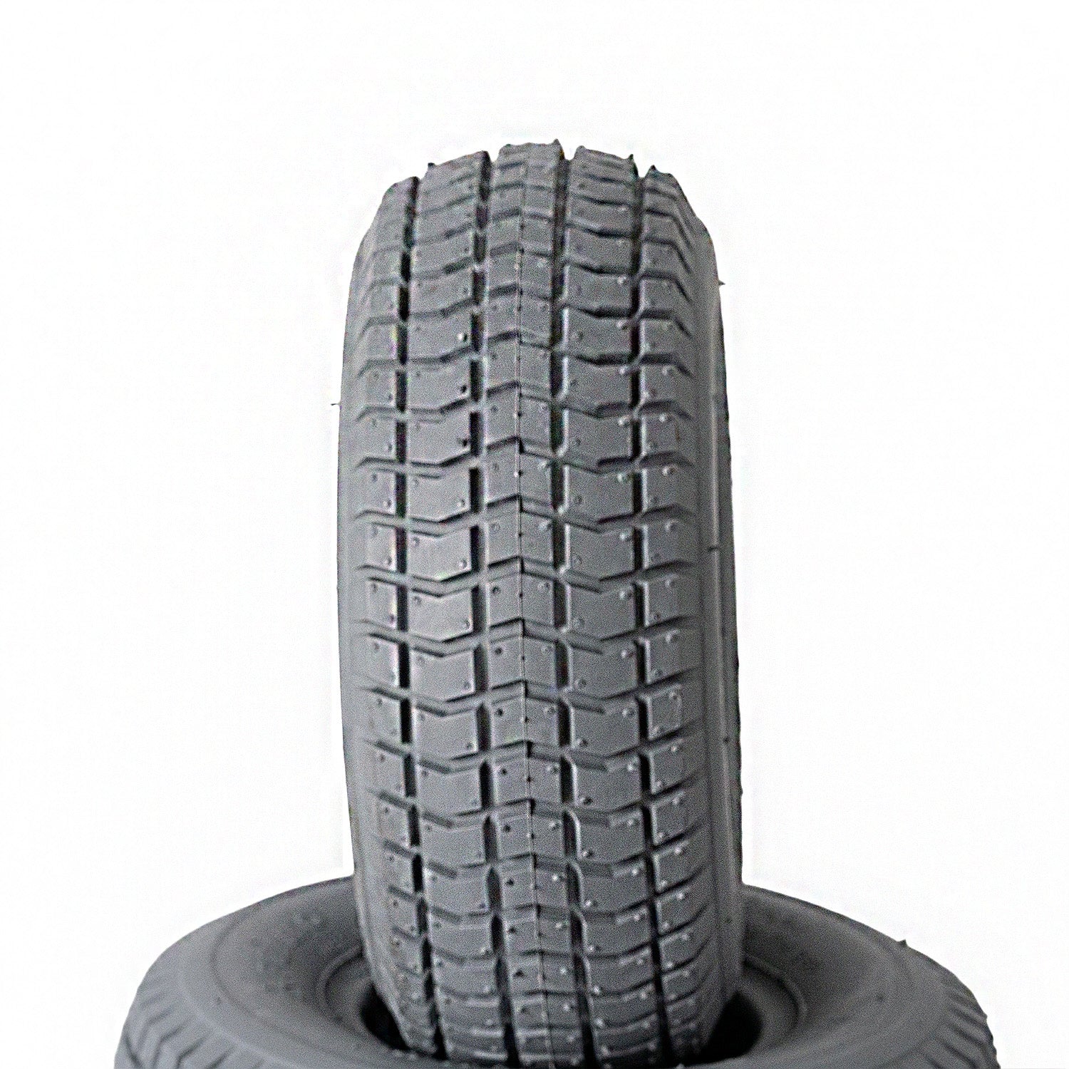 Close-up of the 9x3.50-4 Foam Filled Mobility Tire with C203 Grande Knobby Tread, showcasing detailed tread pattern designed for mobility scooters and power chairs.