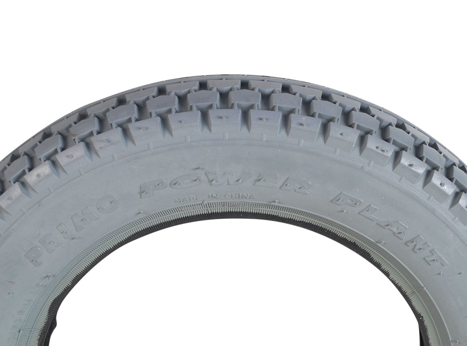 Close-up of the 2.50-8 Pneumatic Mobility Tire with C177G Power Plant Tread by Primo, showcasing its detailed knobby tread design, emphasizing its suitability for enhanced ride comfort and mobility.