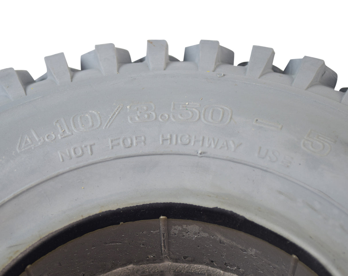 Close-up of a 12x4 (4.10/3.50-5) foam-filled mobility tire with C156 knobby tread, showcasing the durable, flat-free design ideal for both indoor and outdoor use.