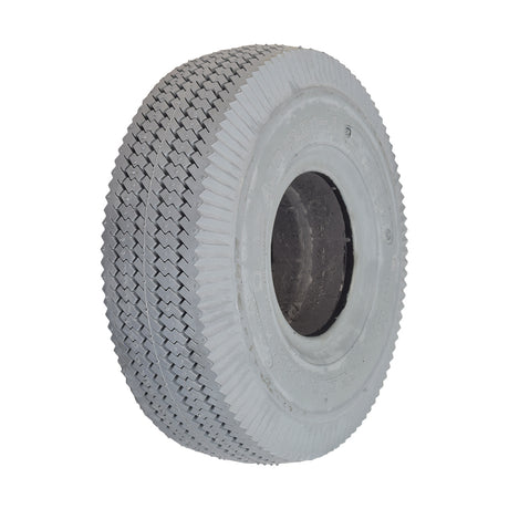 Close-up of the 4.10/3.50-4 Foam-Filled Mobility Tire with C189 Sawtooth Tread, showcasing its detailed synthetic rubber texture and central hole, designed for mobility scooters and power wheelchairs.